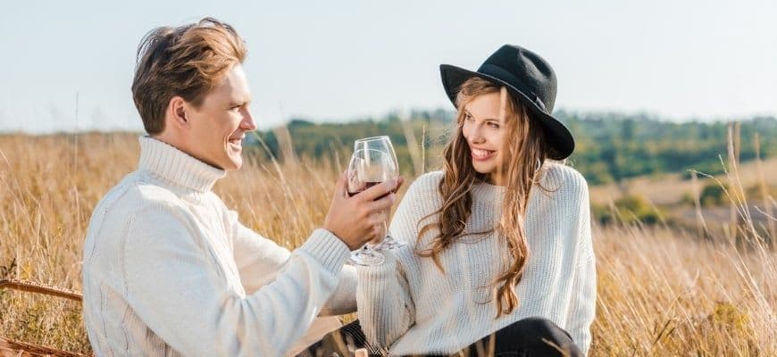 Couple having an outdoor date at the field.