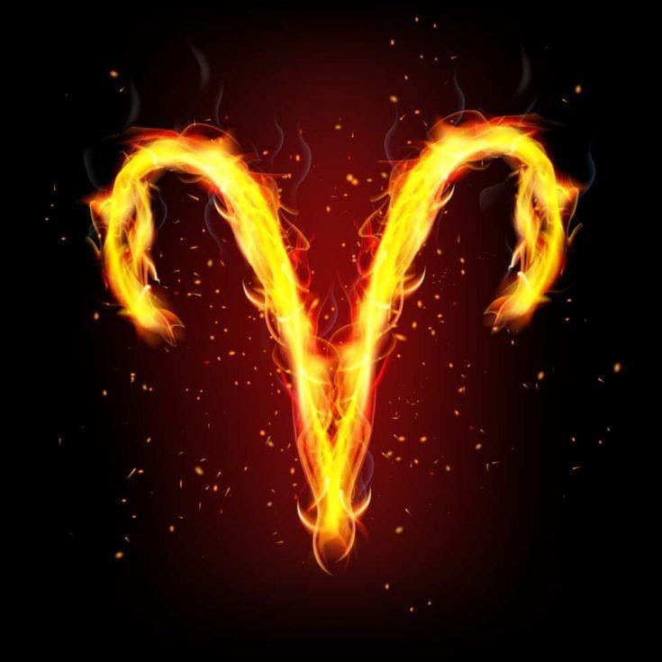 Abstract design of Zodiac sign for Aries in fire flames on dark background