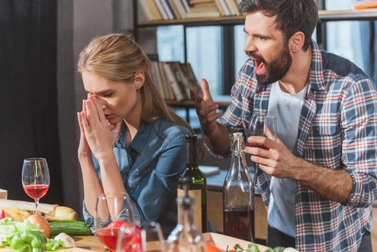 Young couple quarrel, boyfriend yelling on his sad girlfriend