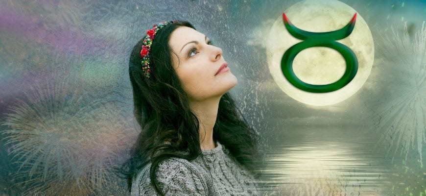 woman looking up with a taurus sign